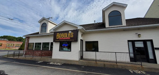 Bobola’s cream-colored building with the yellow Bobola’s sign above the front windows
